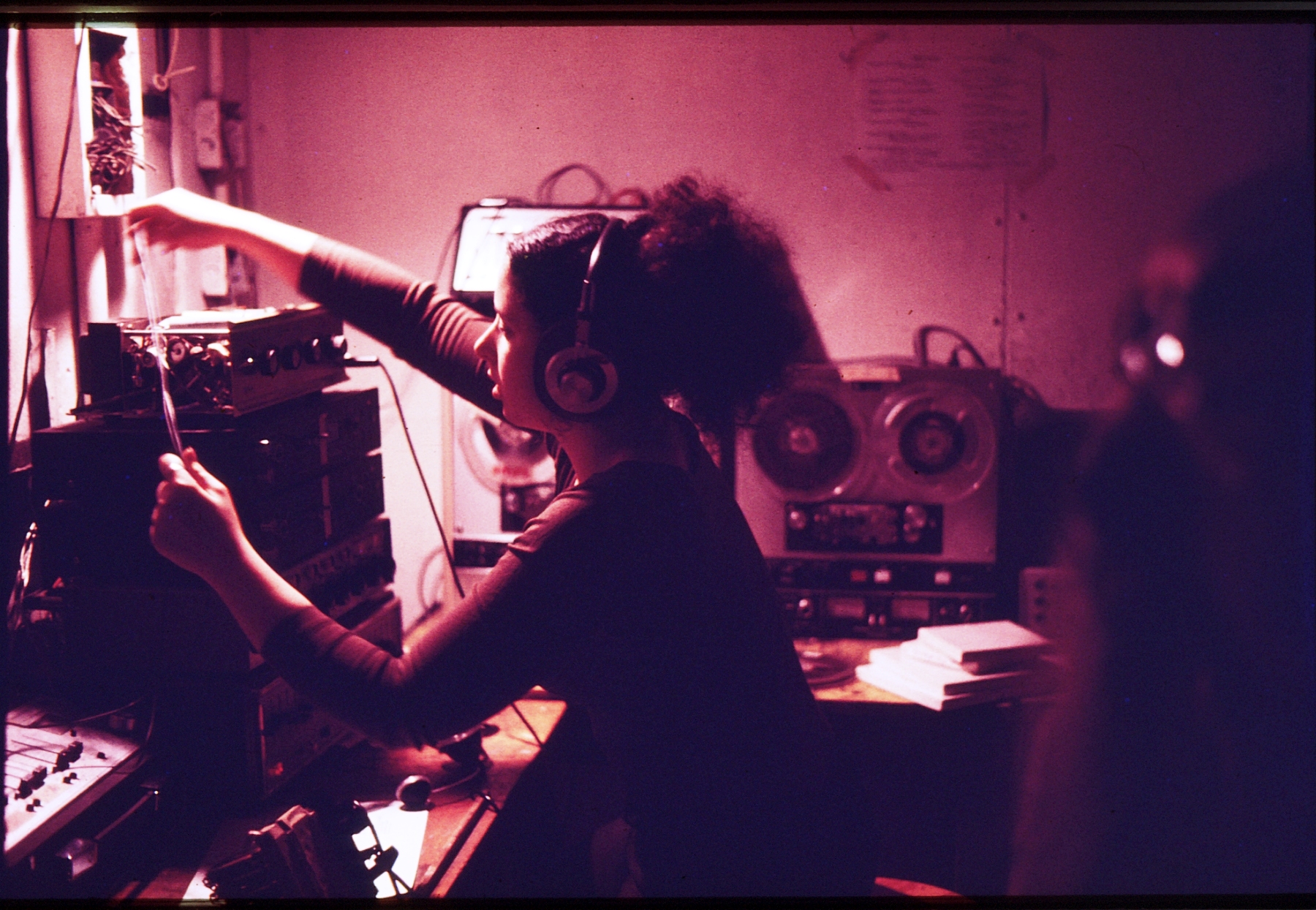 SIM alum Amy Cotton teching a show in the projection booth in the Longwood Theater. During her time at MassArt, Cotton was a participant in the ZONE production of Kandinsky’s Yellow Sound at the Guggenheim Museum in NYC.